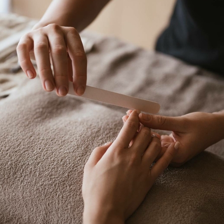 Spa manicure at Feldhof A person files another person's nails during a manicure in the spa.